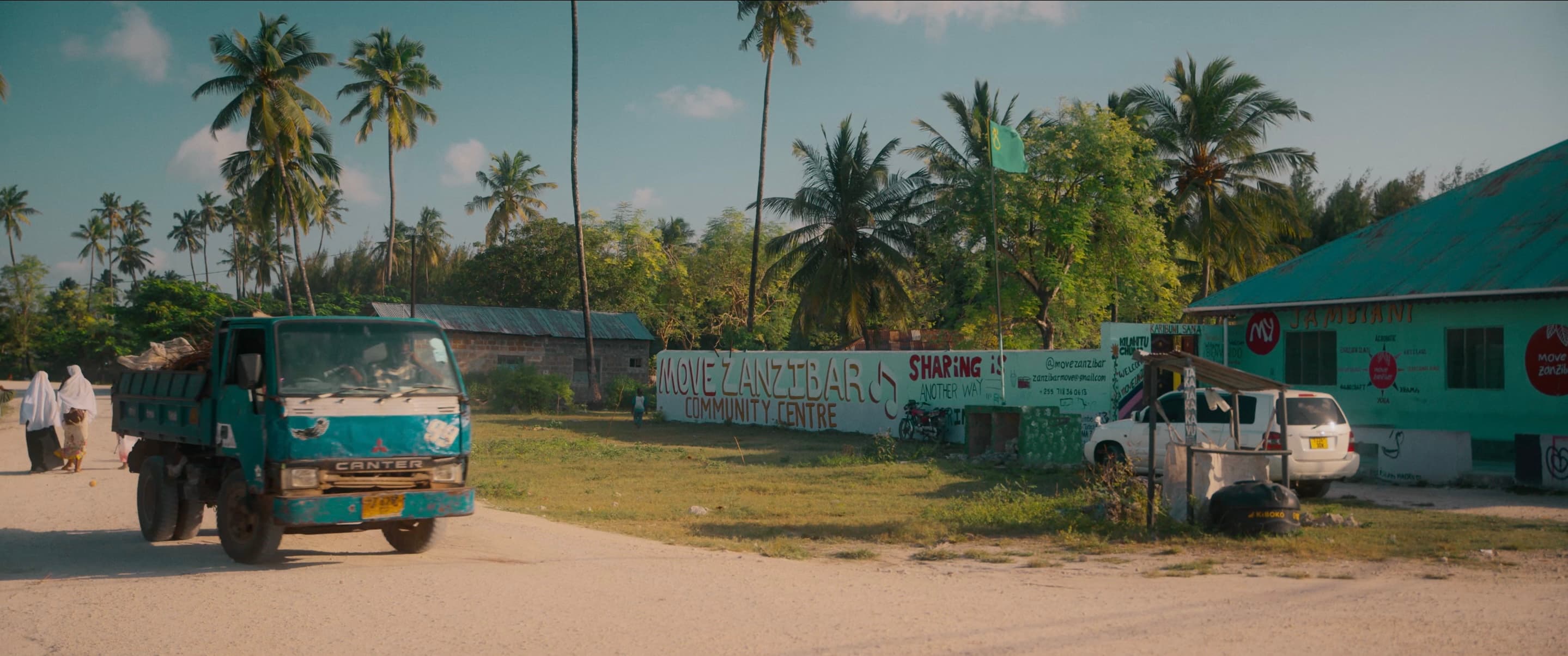 Entrance to the Move Zanzibar Community Centre in Jambiani, with its painted mural wall and palm trees